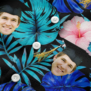 graduation caps tossed over hibiscus blooms on monstera hawaiian shirt